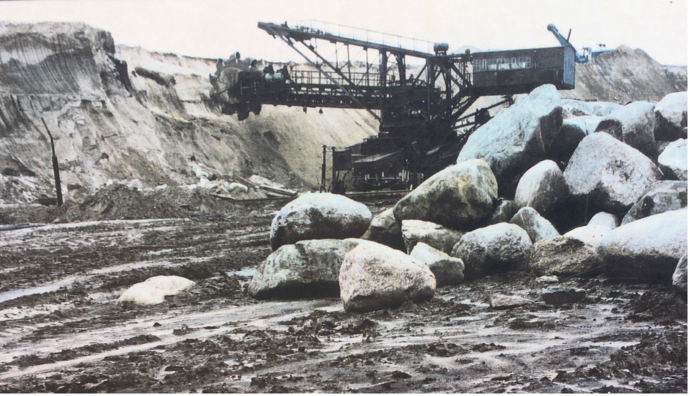 image of an old photo showing boulders and excavation